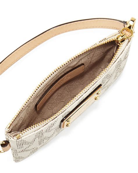 white michael kors wristlet with gold embeded dots|Michael Kors clutch outlet.